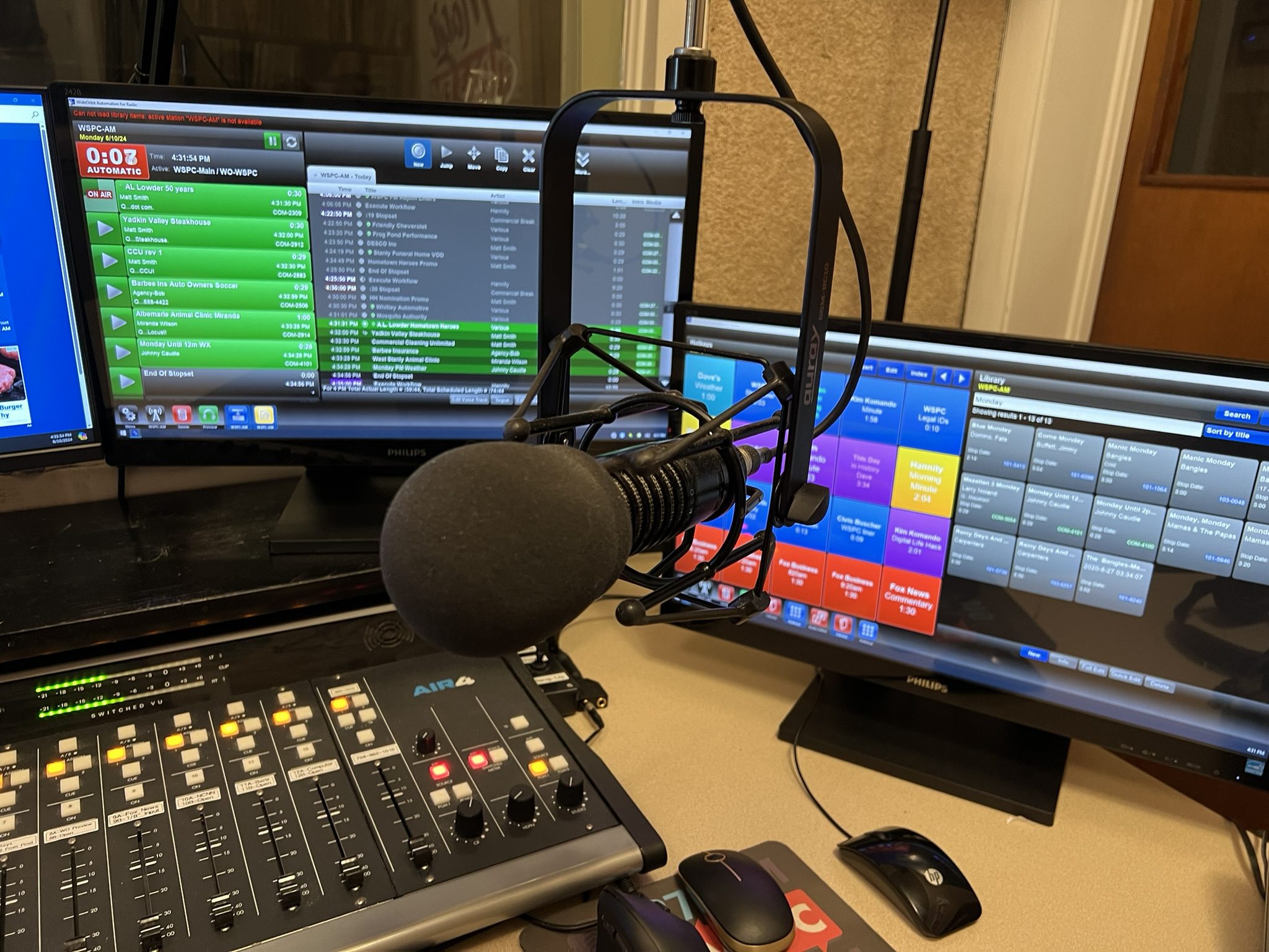 Radio Station Microphone With Laptops And Screens